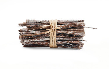 Side view of dry twigs tied in a bundle with natural twine isolated on a white background.
