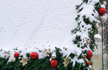 Christmas decorations under snow