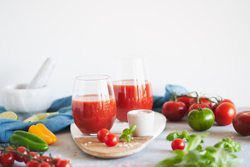 The juice from the tomatoes and peppers on grey background