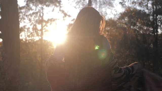 Young Woman Enjoys Morning Sunlight in Nature, Sun Flare. Slow Motion 