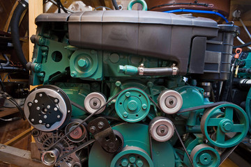 Metal internal combustion engine for a motor boat close-up in the compartment