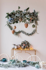 New Year's and Christmas! Beautiful decorations for Christmas, fireplace, tree, toys, gifts, cones, festive lights.