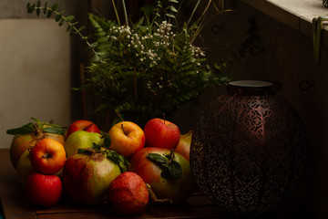Composition of Autumn fruits (pomegranates, apples, pears)