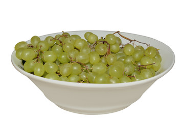 Large plate with green grapes isolated on white background
