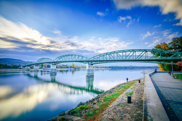 Fototapeta na wymiar Bridge over Danube river between the Hungary and Slovakia, European Union countries. On the left side bank of Danube is Estergom city - the first capital of Hungary, Europe. Breaking borders concept.