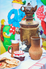 Beautiful rustic crockery jugs and mugs with retro copper samova