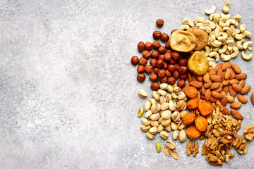 Assortment of nuts and dried fruits - healthy snack.Top view with copy space.