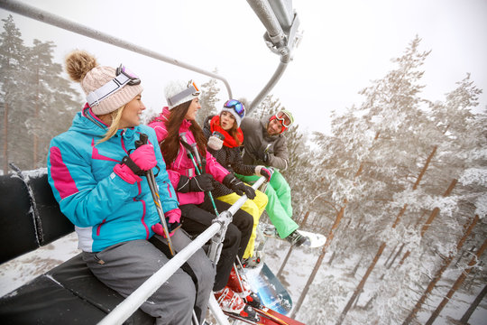 Female and male skiers in ski lift