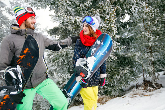 Snowboarders couple in mountain on skiing