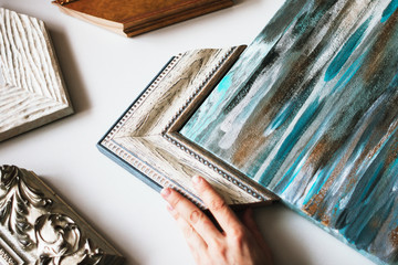 Choosing the frame for a painting.