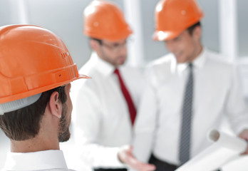 close up. businessman in hard-hat looking at his office