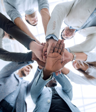 business background.business team making a stack of hands