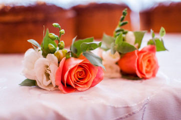 Orange roses on the white table