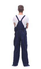 rear view.young man in blue overalls.