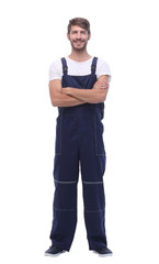 in full growth. smiling man in blue overalls