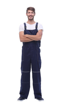 In Full Growth. Smiling Man In Blue Overalls