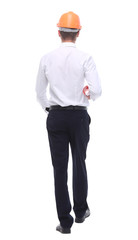 in full growth. smiling architect confidently strides forward