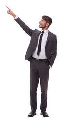 full growth. smiling businessman pointing to copy space