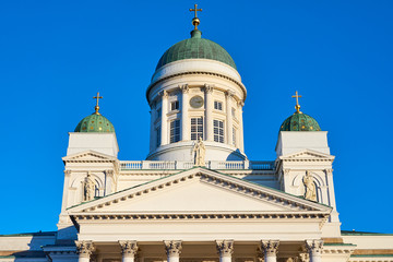 Fototapeta na wymiar Clocktower of Helsinki Cathedral against a blue sky close up. 