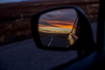 Icelandic road in rear view mirror