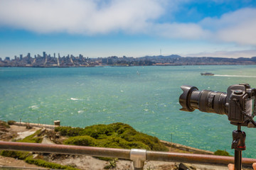 Sea view from Alcatraz island of camera taking pictures of the San Francisco Financial District...