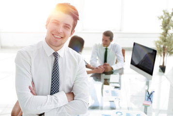 successful businessman on background of office.