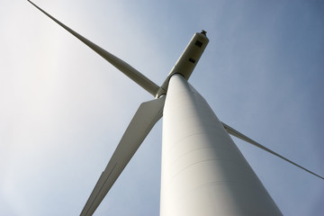 Looking up from the base of a wind turbine