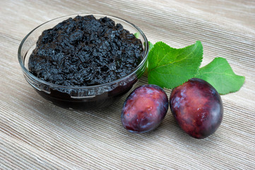 Plum and jam on the table