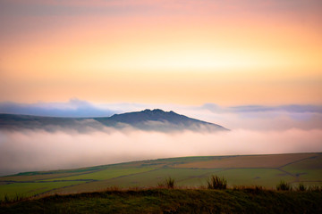 Scenic landscape of Pembrokeshire coast, Uk.Sunrise over misty fields.