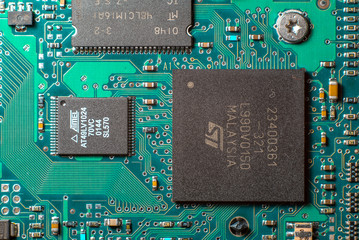 Minsk, Belarus, 2018. Computer chip on green motherboard closeup macro. Computer technology concept