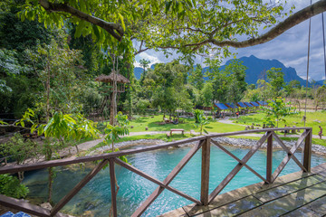 Blue lagoon with mountains and tree of lao,Places to visit Vang Viang-Lao © weerawat