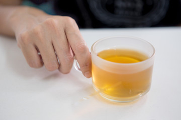 Woman hand holding a cup of tea