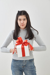 Fototapeta premium Young woman happy hold gift box in hands