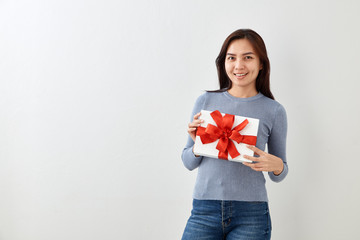 Young woman happy hold gift box in hands