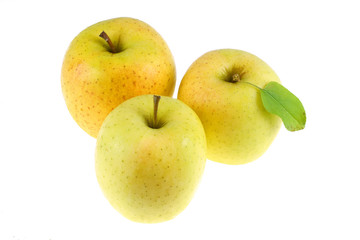 close up on golden delicious apples isolated on white background