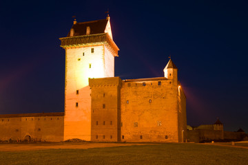 Herman's Castle in the night illumination close-up. Narva, Estonia