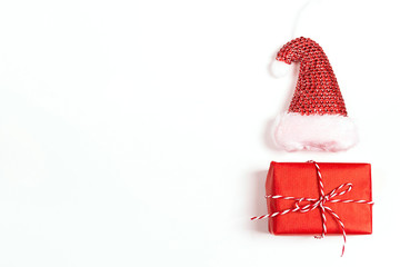 Gift box with Santa hat and copy space on white background.