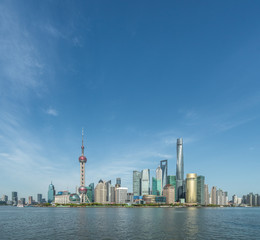 Shanghai skyline against blue sky