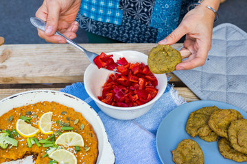 Fresh raw Red bell Bulgarian pepper or capsicum salad with homemade corn bread and pumpkin vegetable casserole. Paleo diet. Vegan lunch, vegetarian dinner, healthy food