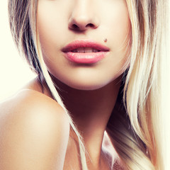Part of female face. Lips, neck and shoulder of beauty model girl. Natural nude make-up, clean...