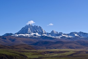 Tibetan holy mountain Mt. Yala with its summit at 5820m, taken from Tagong, Sichuan, China. 
