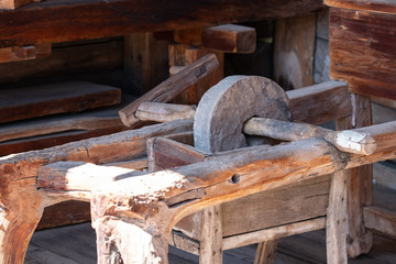 Photo of an old manual grinding stone.