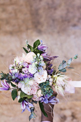 Beautiful bouquet with delicate flowers. Pink-white-purple bouquet. Bridal bouquet in female hands