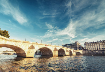 Fototapeta premium Bridge over Seine river in Paris, France at daytime. Travel and architectural background.