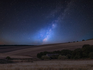 Vibrant Milky Way composite image over landscape of English countryside © veneratio