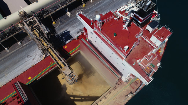 Wide Drone Shot Of Ship Loading Bulk Grain In Australian Port.