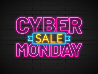 Neon text Cyber Monday Sale in pink and yellow color on brick wall background.