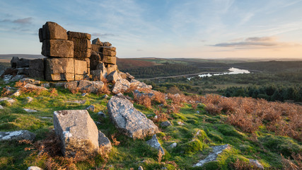 Stunning Autumn sunset landscape image of view from Leather Tor towards Burrator Reservoir in Dartmoor National Park