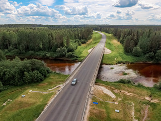 Road with a bridge in the forest