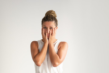 Upset pretty Latin girl covering face and looking tired. Portrait of young Hispanic manager finding...